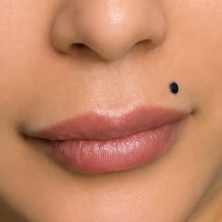 One dot. Endless charm. A beauty mark that adds softness, mystery, and a touch of timeless femininit